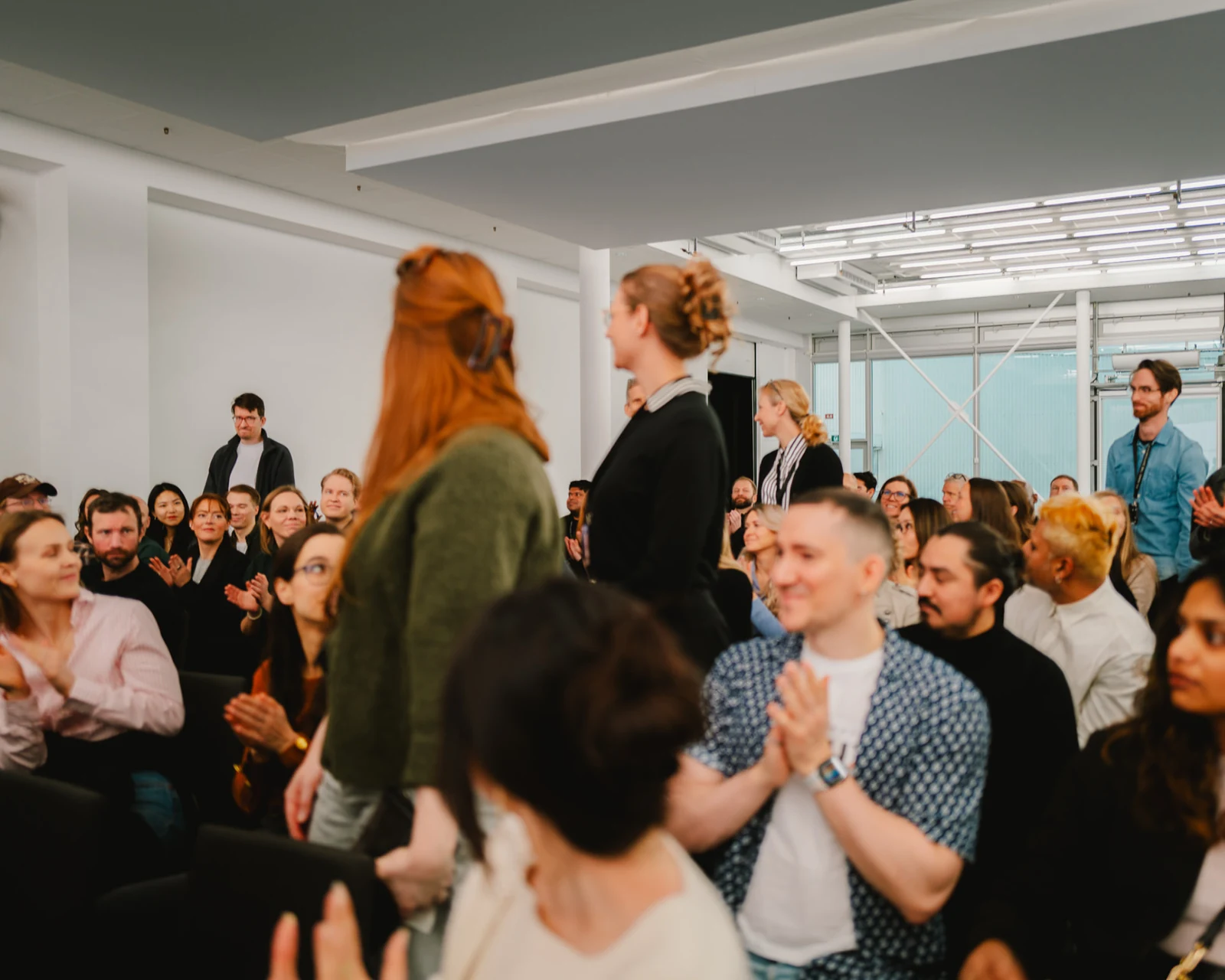 An audience applauding during a Volvo all-hands