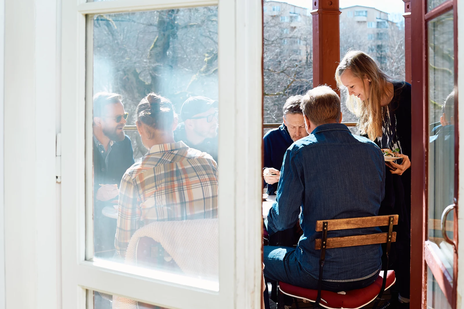 Veryday colleagues sharing lunch on the studio terrace