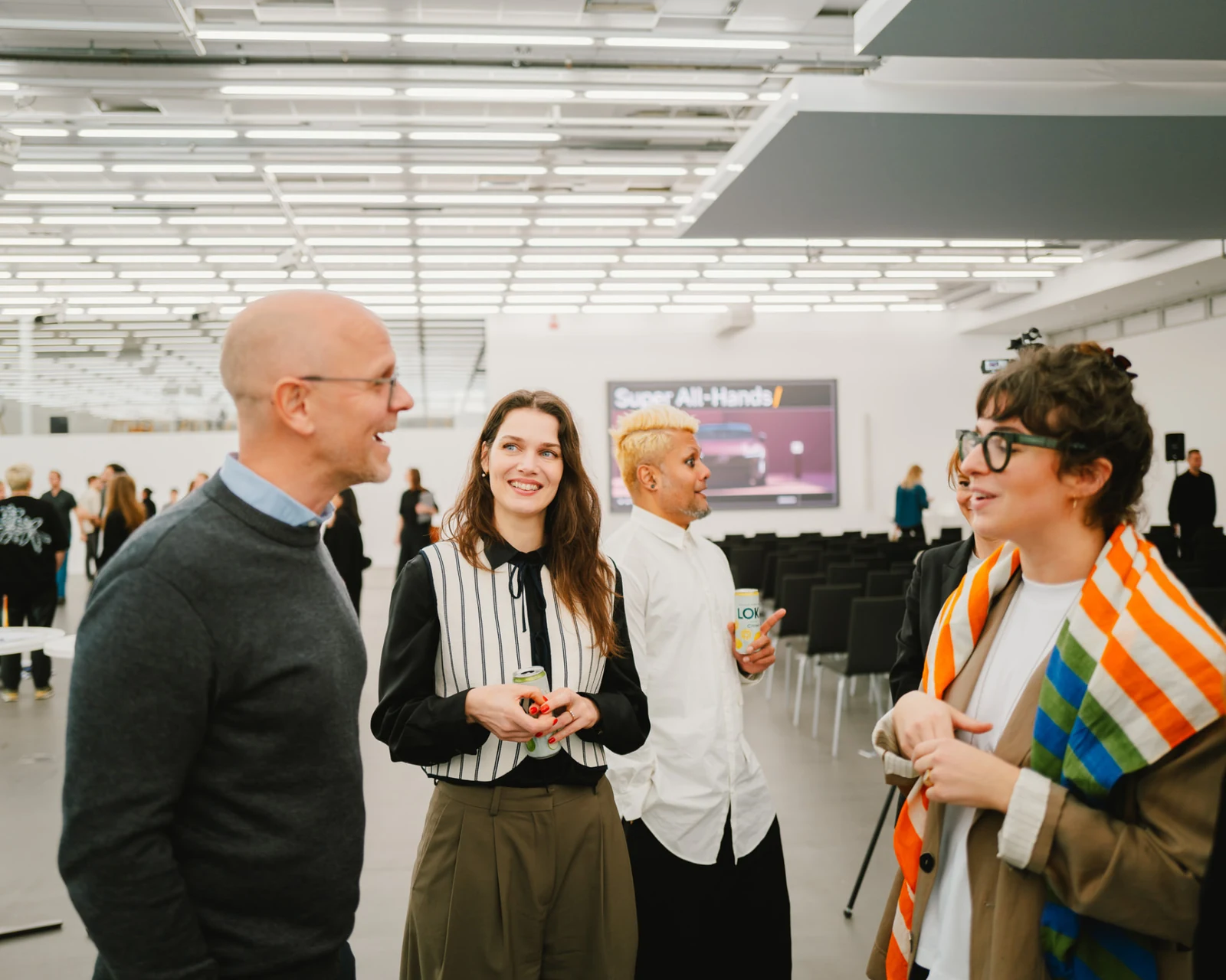Colleagues talking together at a Volvo all-hands gathering